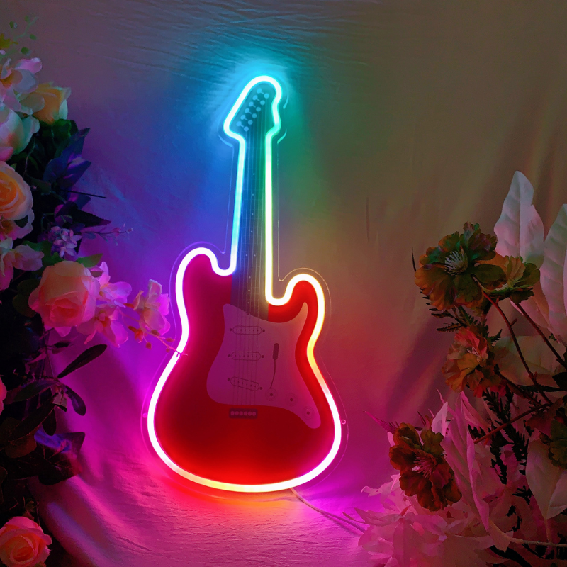 Neon guitar sign displaying a spectrum of changing RGB colors.