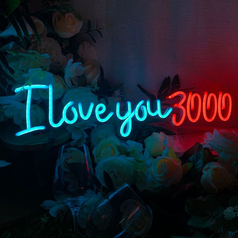 NEON sign from SELICOR illuminating I Love You 3000 in stunning script designed to add a romantic touch to wedding settings