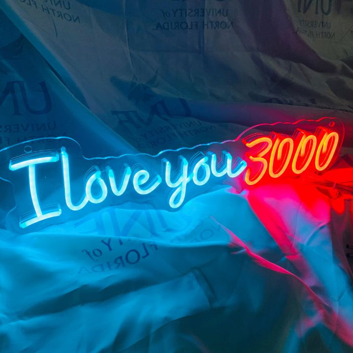 SELICOR's neon wedding decor featuring the phrase I Love You 3000 in radiant stylized lettering perfect for a romantic ambiance