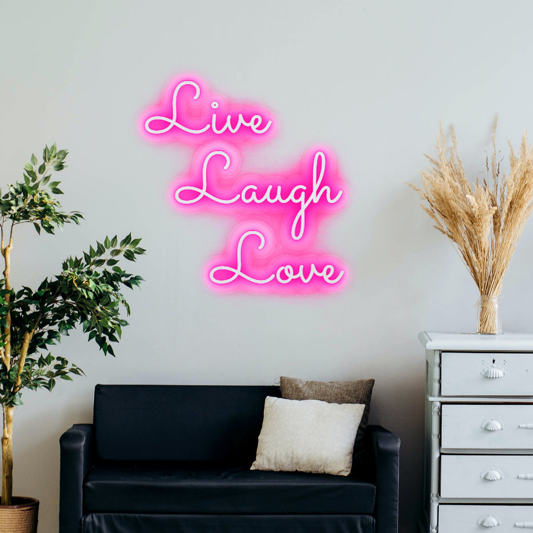 live laugh love neon sign in pink decor living room